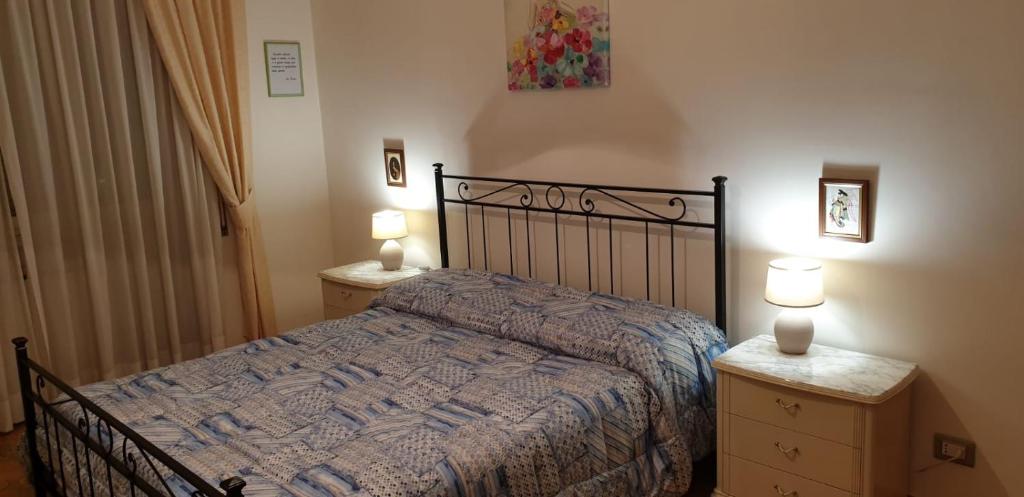 Postel nebo postele na pokoji v ubytování Villa del colle