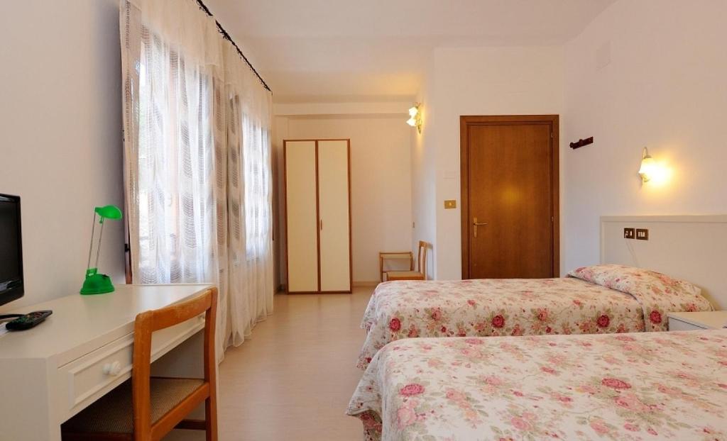 Postel nebo postele na pokoji v ubytování Hotel San Sebastiano