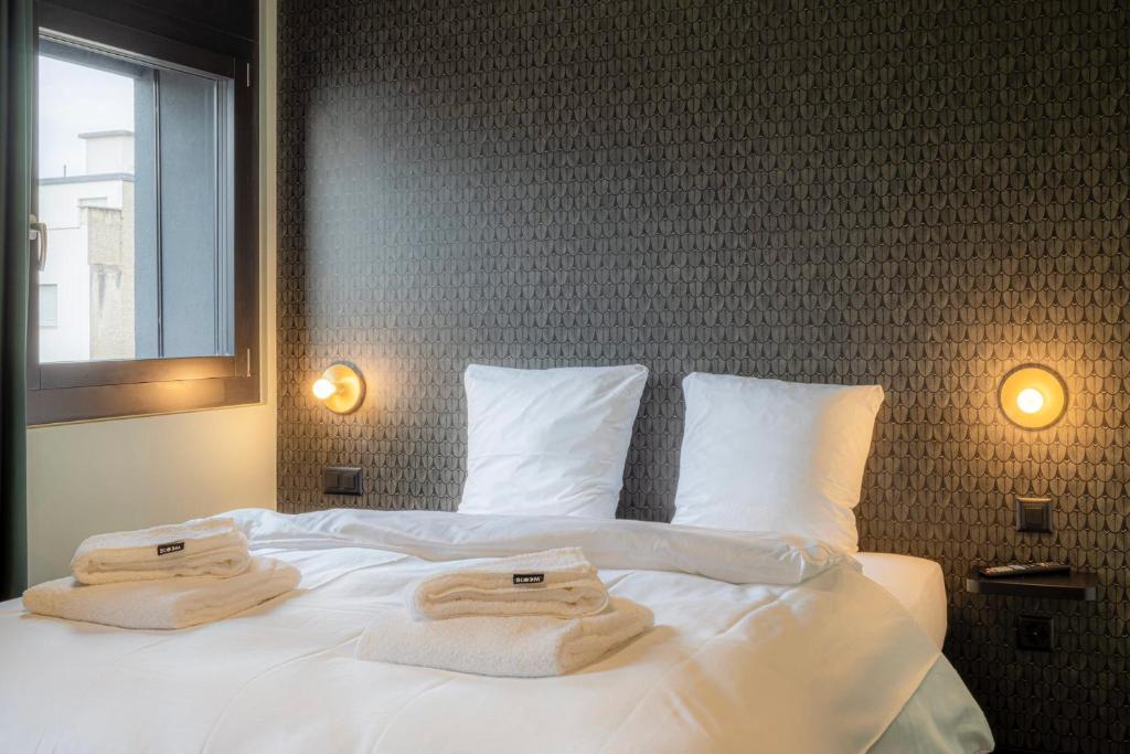 Postel nebo postele na pokoji v ubytování BLOOM Boutique Hotel & Lounge Basel