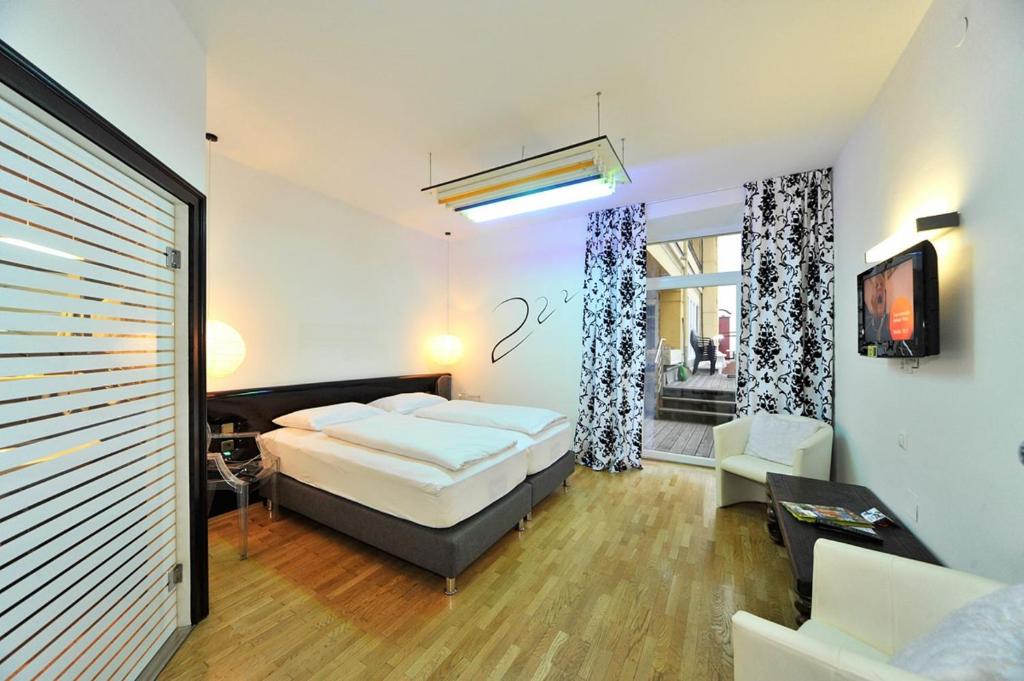 Postel nebo postele na pokoji v ubytování Erlebnis Post - Stadthotel mit EigenART