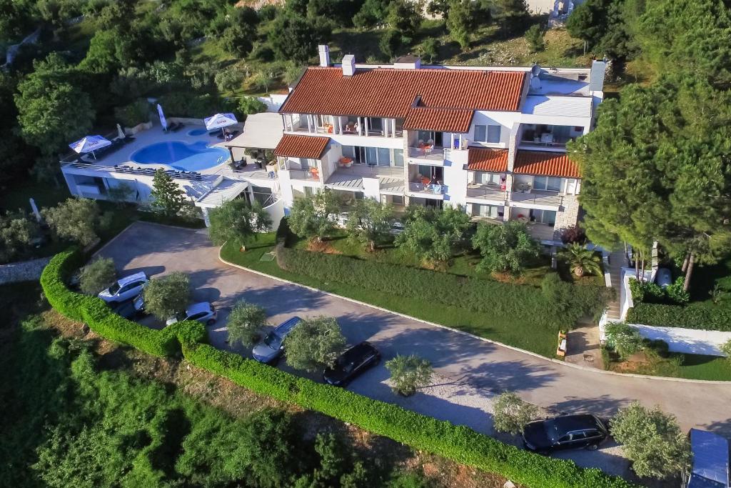 an aerial view of a house with a swimming pool at Hotel Villa Annette in Rabac