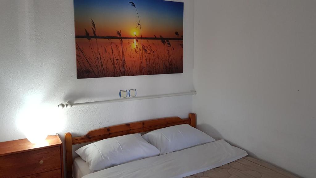 Postel nebo postele na pokoji v ubytování Pension Antonakis Ouranoupolis Greece