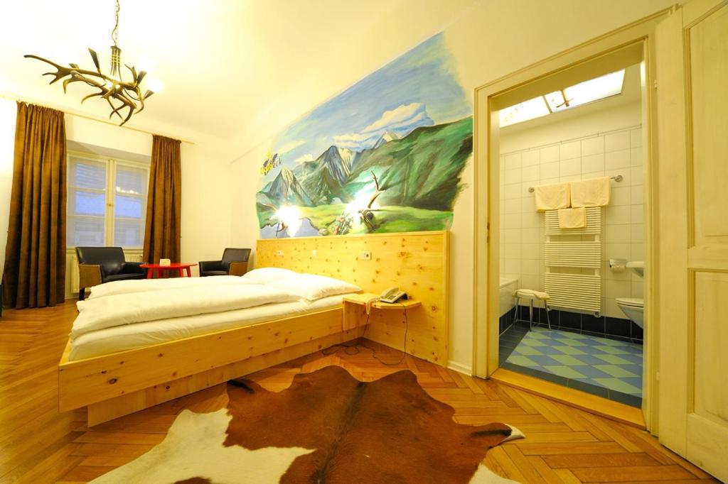 Postel nebo postele na pokoji v ubytování Erlebnis Post - Stadthotel mit EigenART