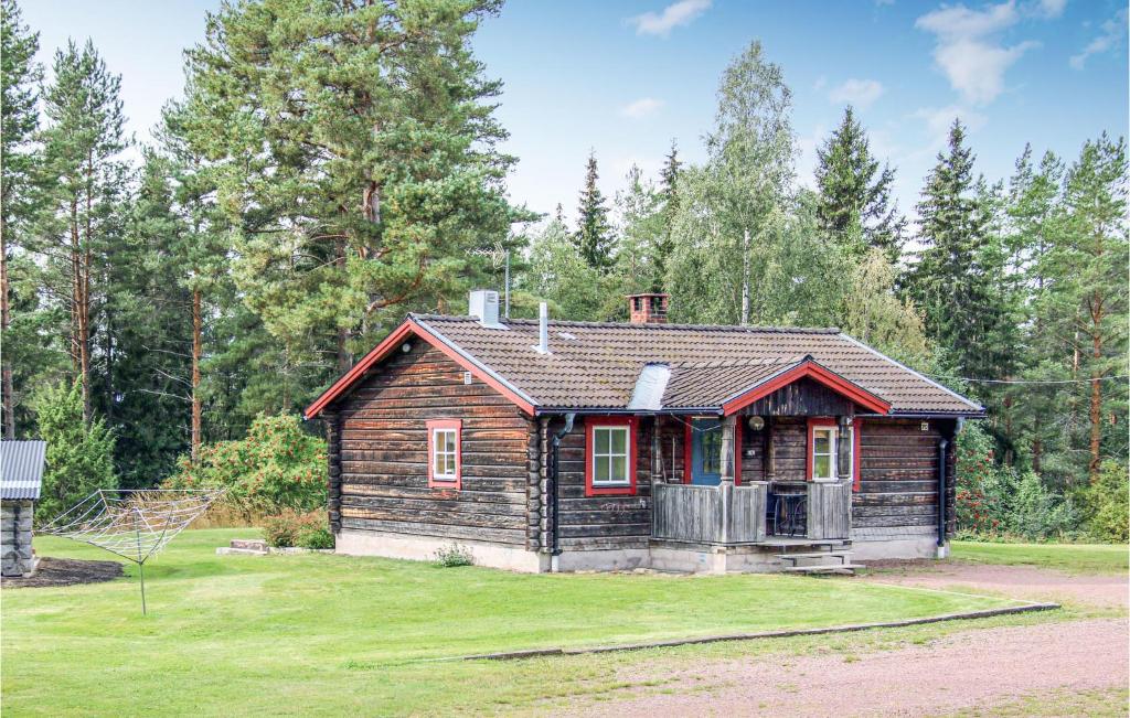 a small wooden house in the middle of a yard at Nice Home In lvdalen With Wifi in Blyberg