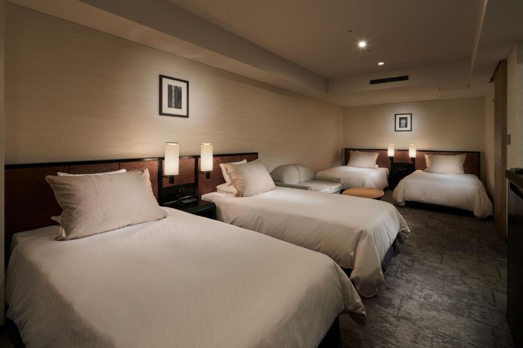 Postel nebo postele na pokoji v ubytování Hotel Granvia Kyoto