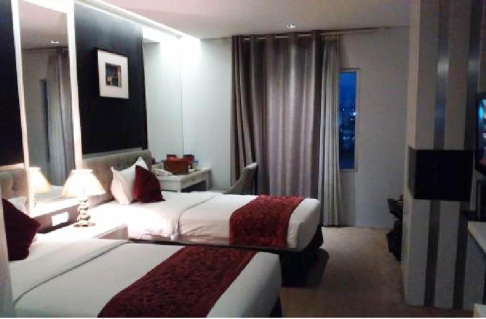 Postel nebo postele na pokoji v ubytování Gino Feruci Braga by KAGUM Hotels