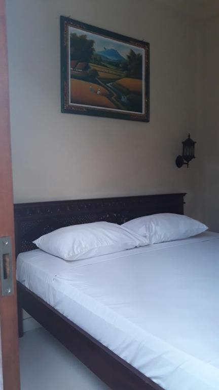 Postel nebo postele na pokoji v ubytování Baruna Guest House