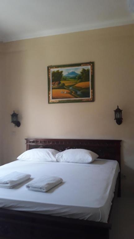 Postel nebo postele na pokoji v ubytování Baruna Guest House