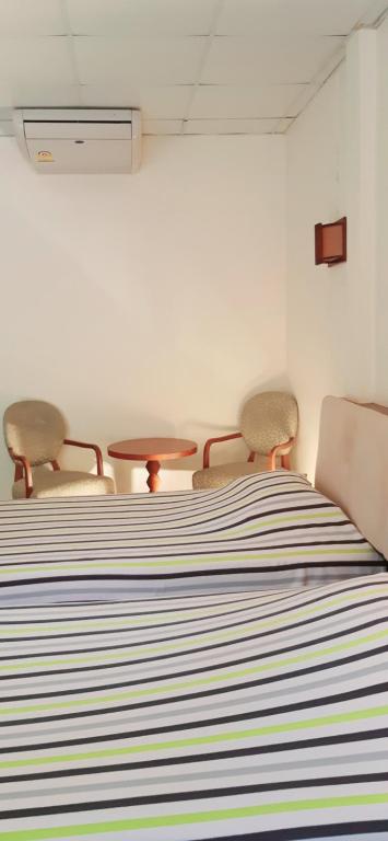 Postel nebo postele na pokoji v ubytování Rai Win Resort