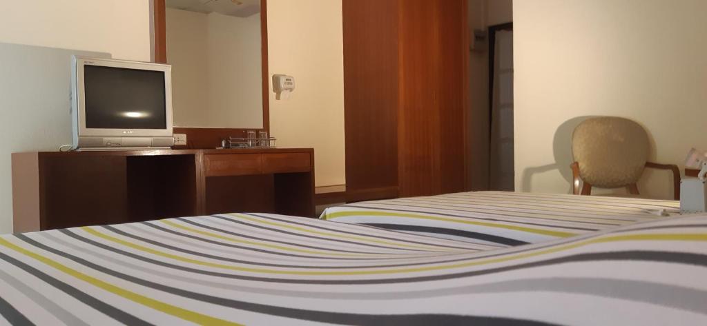 Postel nebo postele na pokoji v ubytování Rai Win Resort