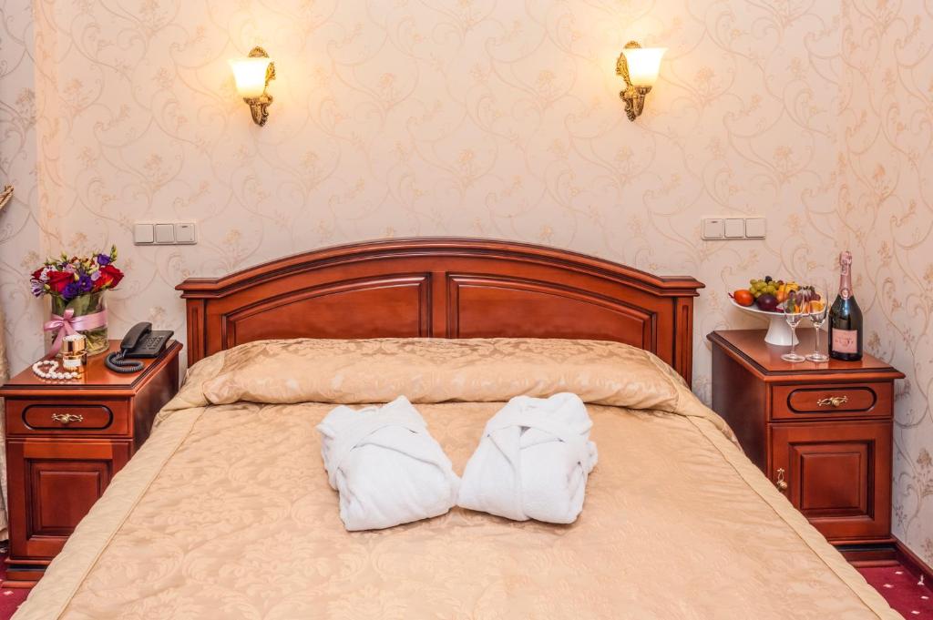 Postel nebo postele na pokoji v ubytování Hotel Kyiv