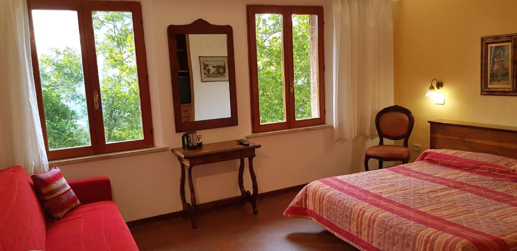 Postel nebo postele na pokoji v ubytování Hotel Rifugio Prategiano