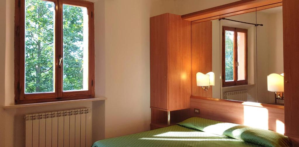 Postel nebo postele na pokoji v ubytování Hotel Rifugio Prategiano