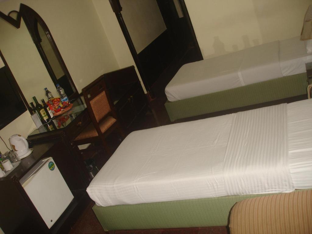 Postel nebo postele na pokoji v ubytování Hotel Empires