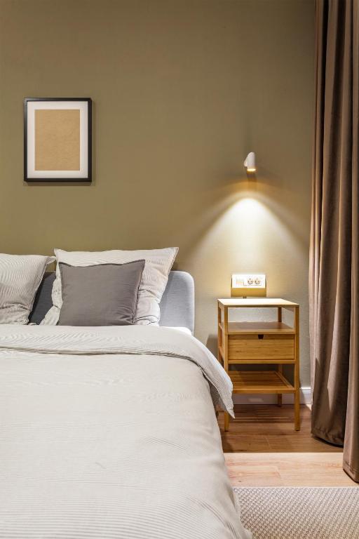 Postel nebo postele na pokoji v ubytování Martin Boutique Hotel