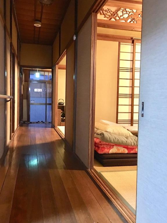 Postel nebo postele na pokoji v ubytování Guest House Enishi
