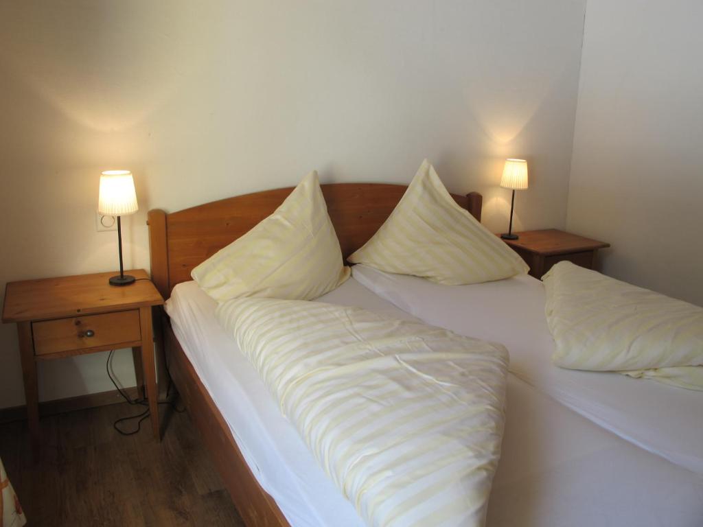 Postel nebo postele na pokoji v ubytování Reitstall und Saloon San Jon