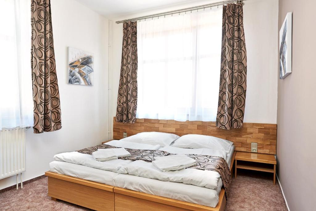 Postel nebo postele na pokoji v ubytování Vila Encore