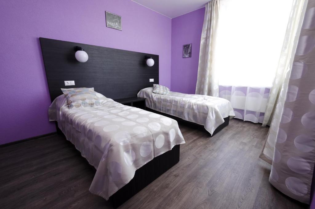 Katil atau katil-katil dalam bilik di Kosmos Guesthouse