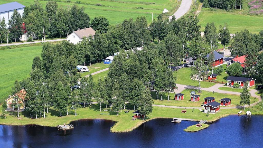 an aerial view of a house on an island in a lake at Tastulan Lomakylä in Kaustinen
