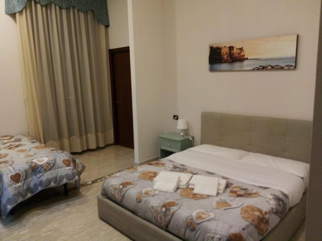 Ένα ή περισσότερα κρεβάτια σε δωμάτιο στο LA dimora di re Ferdinando