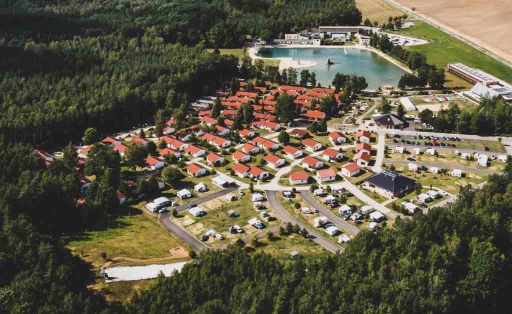 an aerial view of a resort complex next to a lake at Trixi Ferienpark Zittauer Gebirge in Großschönau