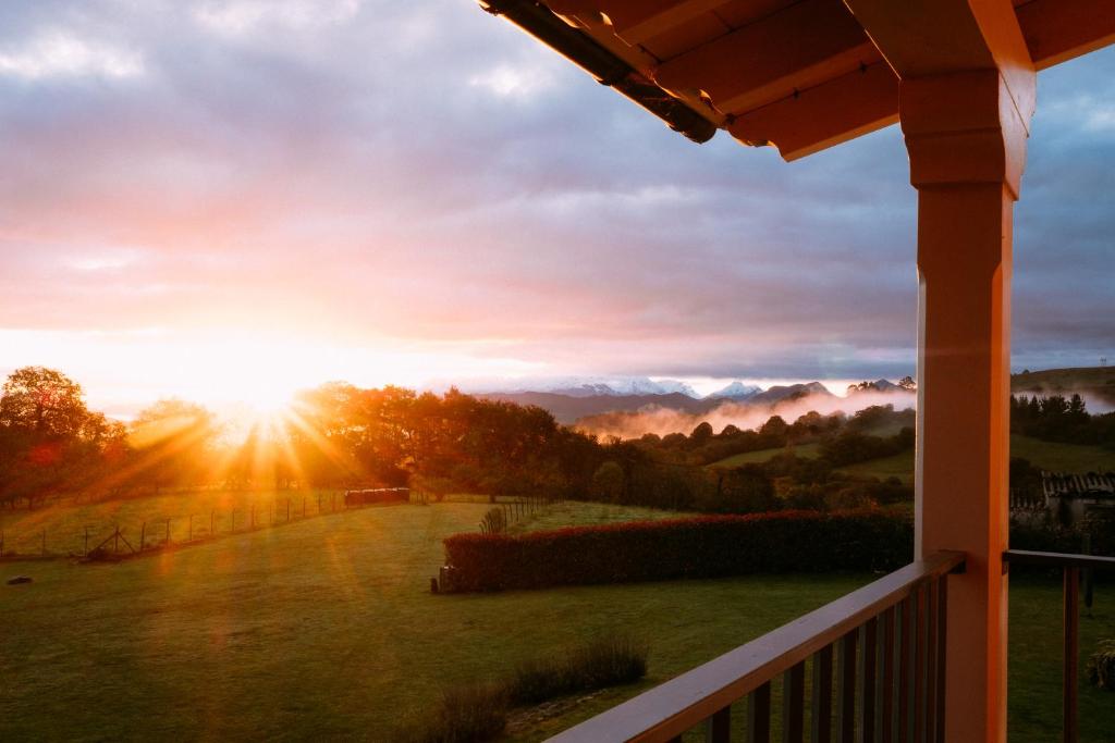 a view of the sunset from the porch of a house at el gran sueño Boutique Hotel & Apartamentos - Adults Only in Pintueles