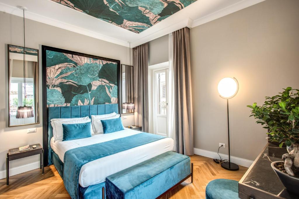 Postel nebo postele na pokoji v ubytování Hotel 55 Fifty-Five - Maison d'Art Collection