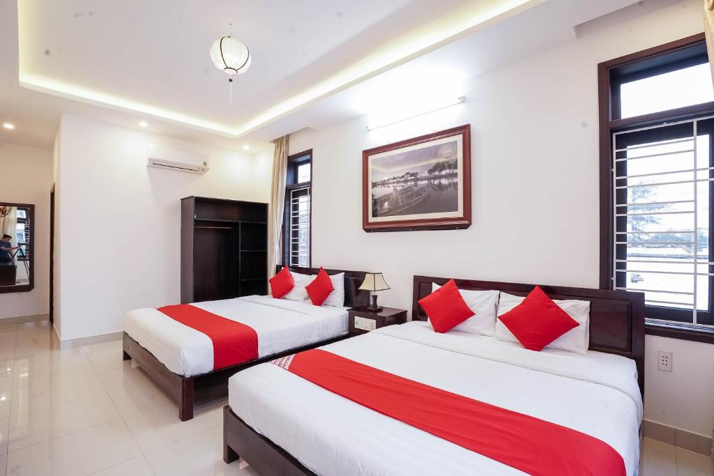 Postel nebo postele na pokoji v ubytování Almond Villa Hoi An