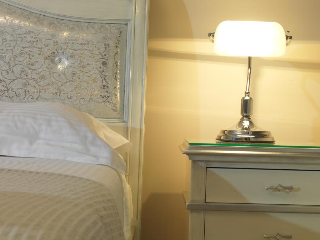 Postel nebo postele na pokoji v ubytování Hondos Classic Hotel & Spa