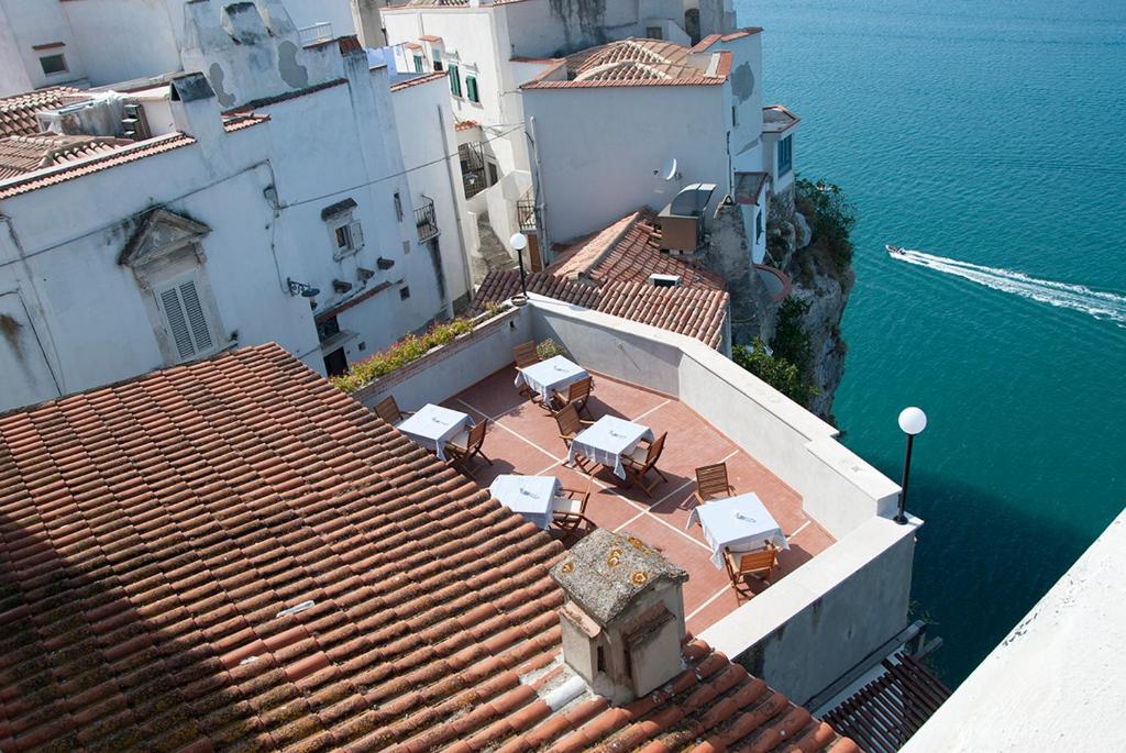 an aerial view of a roof with chairs and the water at Il Barone del Mare in Peschici