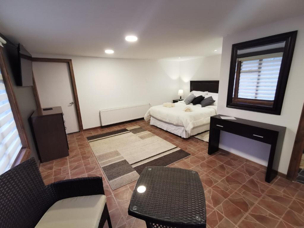 Uma cama ou camas num quarto em SHEUEN PATAGONIA