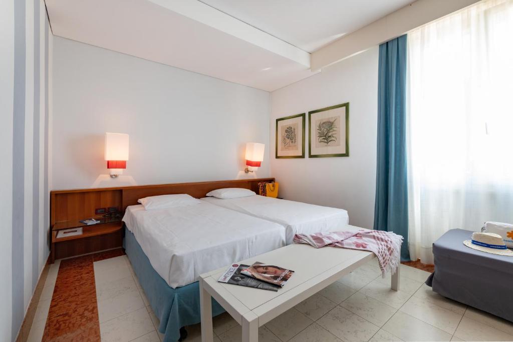 Letto o letti in una camera di Art&Park Hotel Union Lido