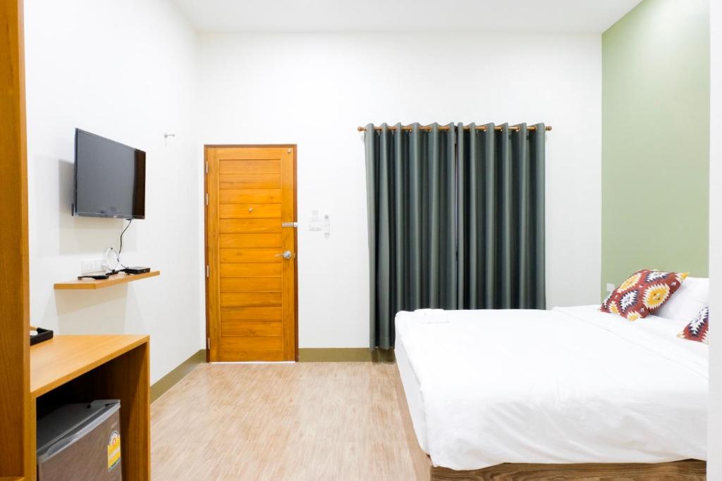 TV a/nebo společenská místnost v ubytování The Cozy Hotel