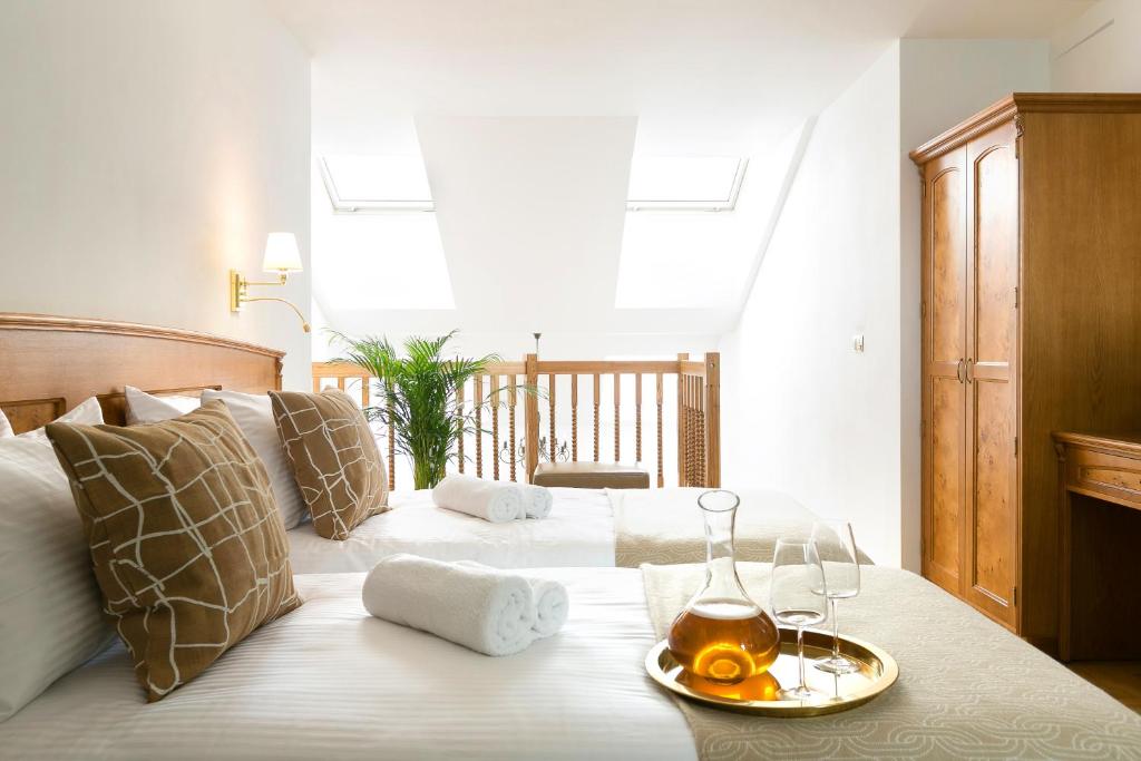 Postel nebo postele na pokoji v ubytování Ventus Rosa Boutique Aparthotel