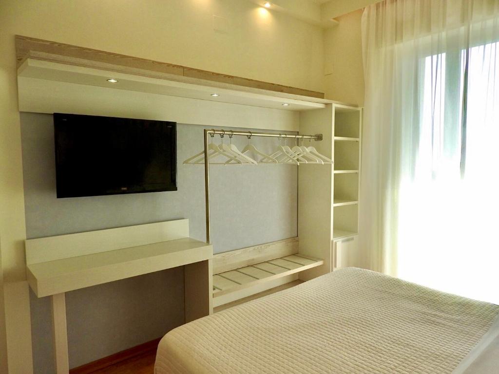 Postel nebo postele na pokoji v ubytování Hotel Aristeo