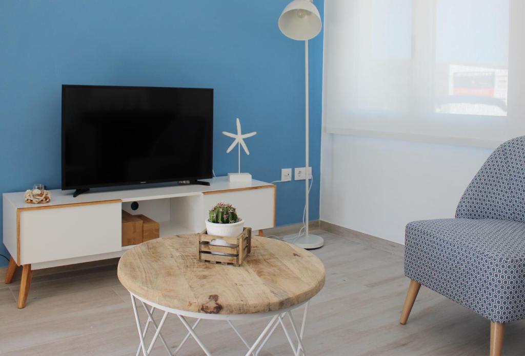 Televízia a/alebo spoločenská miestnosť v ubytovaní Villa La Costa - 3 apartamentos turísticos
