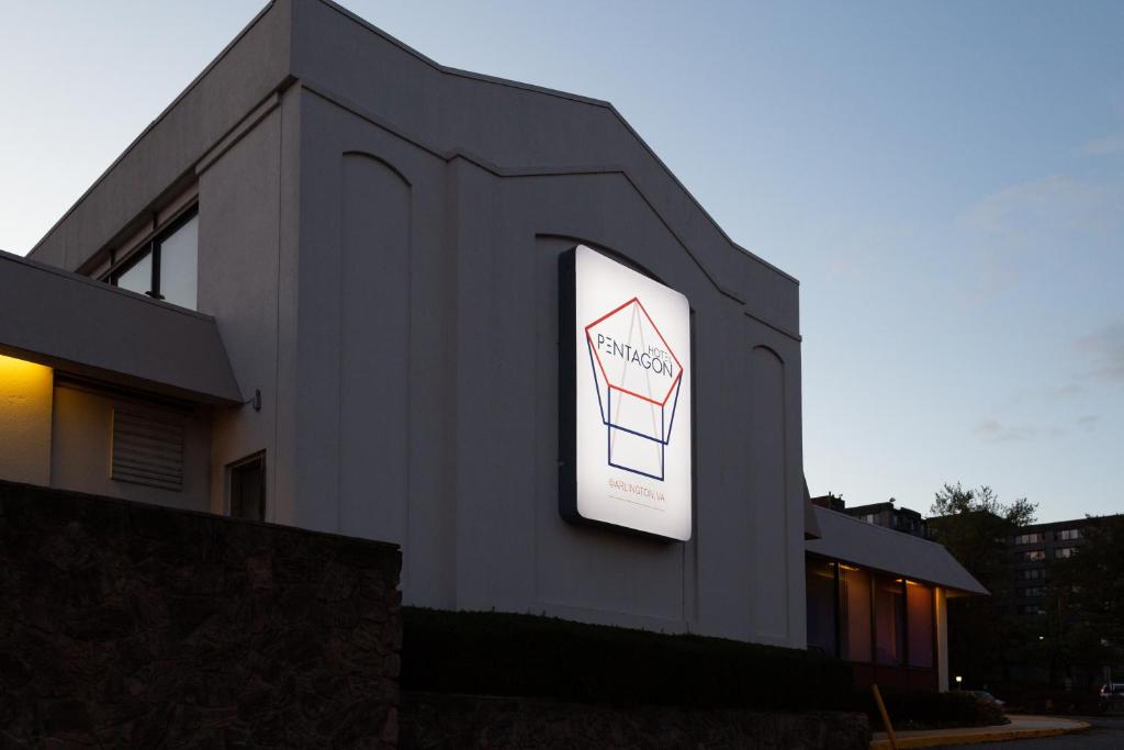 a building with a sign on the side of it at Hotel Pentagon in Arlington