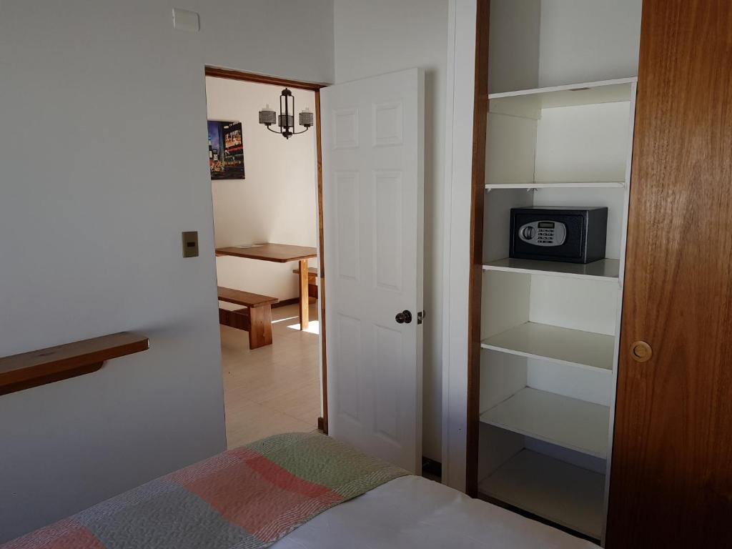 Postel nebo postele na pokoji v ubytování Stellamar Apart Hotel