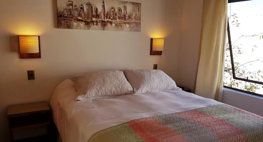 Postel nebo postele na pokoji v ubytování Stellamar Apart Hotel