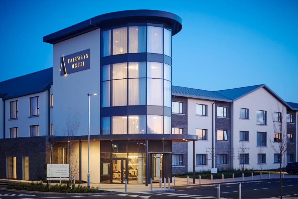 a building with a sign on the front of it at Fairways Hotel Dundalk in Dundalk