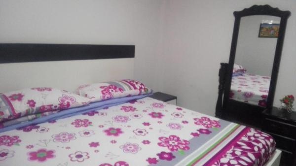 Postel nebo postele na pokoji v ubytování La Roca Coveñas Apartamentos