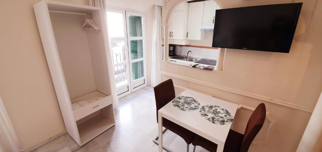 Televízia a/alebo spoločenská miestnosť v ubytovaní Fan Flat Carretería