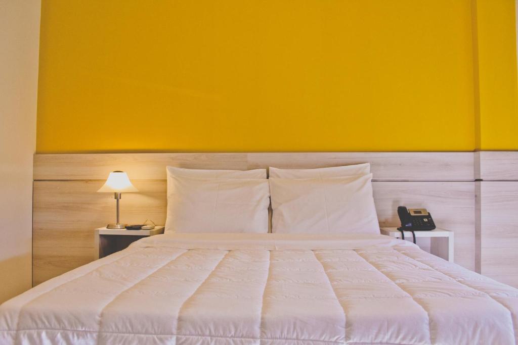 Postel nebo postele na pokoji v ubytování Nova Hotel