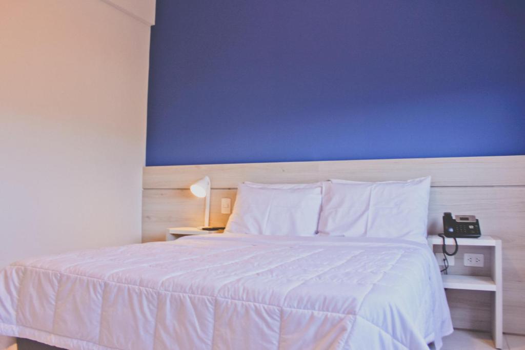 Postel nebo postele na pokoji v ubytování Nova Hotel