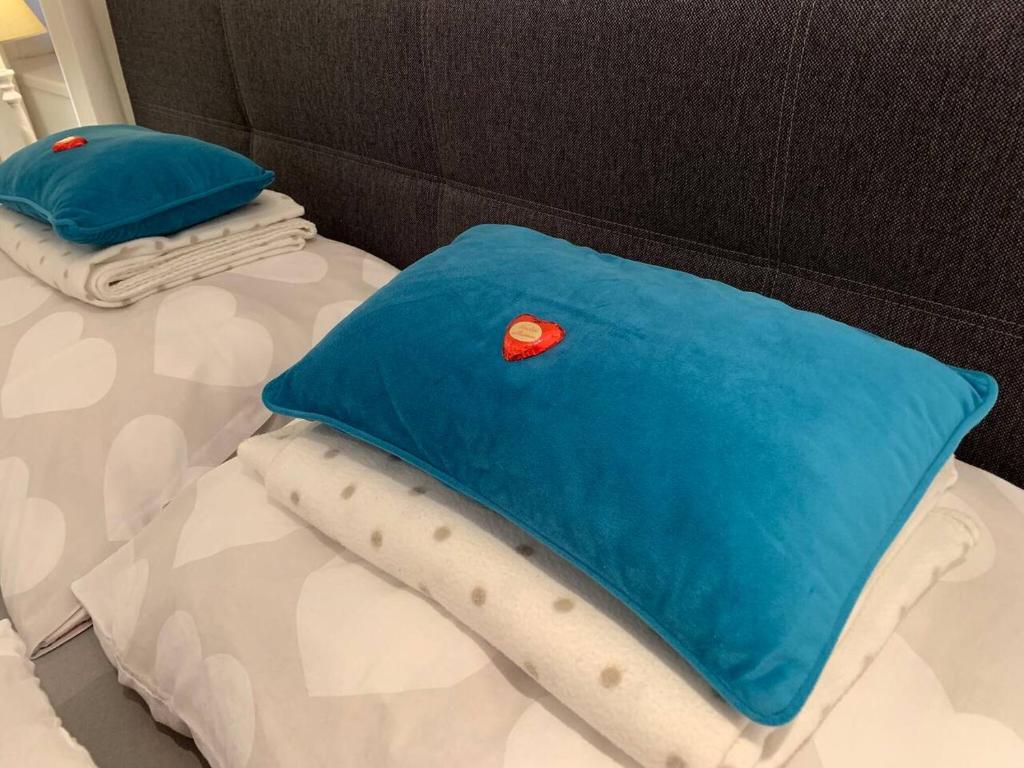 two pillows sitting on top of a bed at Hornhaus in Kitzbühel