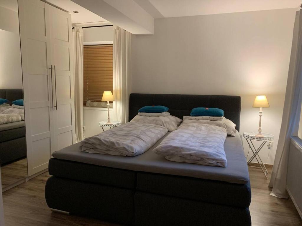a bed in a bedroom with two pillows on it at Hornhaus in Kitzbühel
