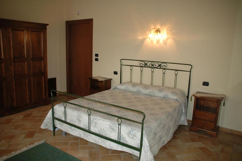 Postel nebo postele na pokoji v ubytování Il Podere del Falco
