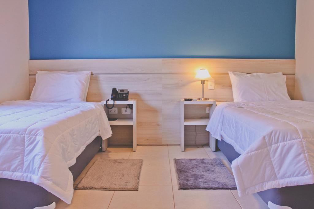 Postel nebo postele na pokoji v ubytování Nova Hotel