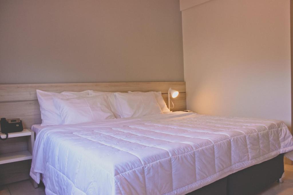 Postel nebo postele na pokoji v ubytování Nova Hotel